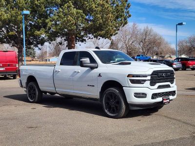2026 RAM 3500 RAM 3500 LARAMIE CREW CAB 4X4 8' BOX in Bright White Clear-Coat Exterior Paint — front three-quarter view