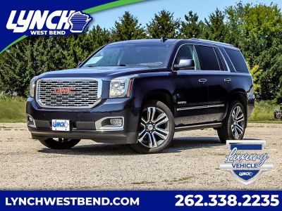 2018 GMC Yukon Denali in Dark Sapphire Blue Metallic — front three-quarter view