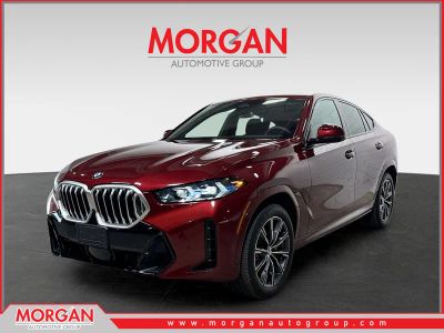 2025 BMW X6 xDrive40i in Aventurin Red Metallic — front three-quarter view