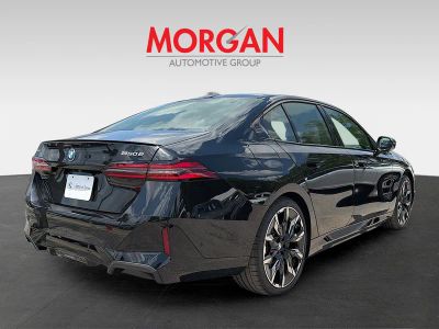 2027 BMW 5 Series — rear three-quarter view