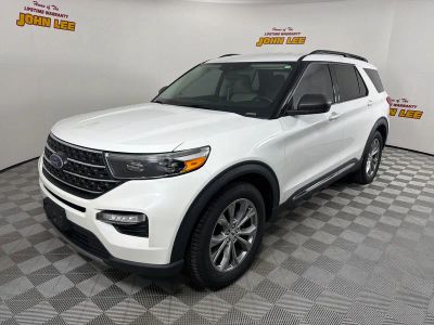 2022 Ford Explorer XLT in Star White Metallic Tri-Coat — front three-quarter view