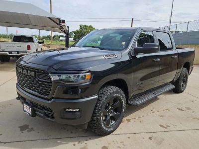 2026 RAM 1500 Warlock in Diamond Black Crystal Pearlcoat — front three-quarter view