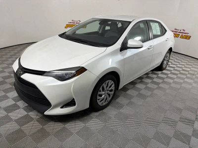 2017 Toyota Corolla LE in Blizzard Pearl — front three-quarter view