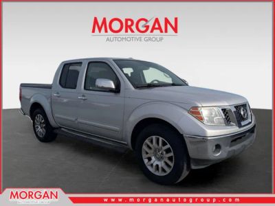 2013 Nissan Frontier SL in Silver — front three-quarter view