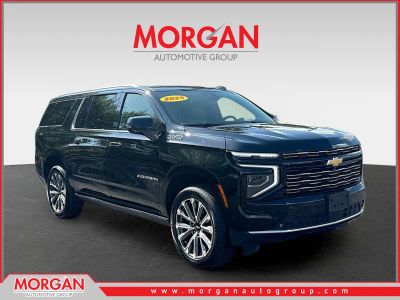 2025 Chevrolet Suburban High Country in Black — front three-quarter view