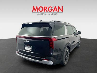 2026 Kia Carnival — rear three-quarter view