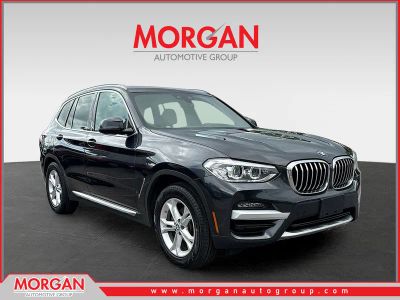 2020 BMW X3 xDrive30i in Dark Graphite Metallic — front three-quarter view