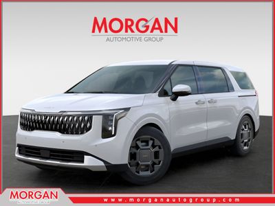 2026 Kia Carnival Hybrid EX in White — front three-quarter view