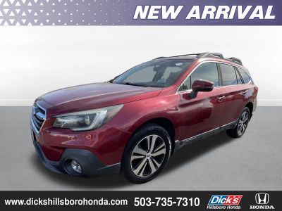 2018 Subaru Outback Limited in Crimson Red Pearl — front three-quarter view