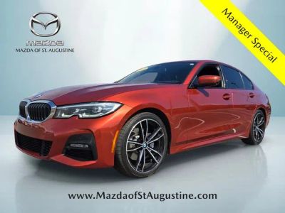 2021 BMW 3 Series 330i in Orange — front three-quarter view