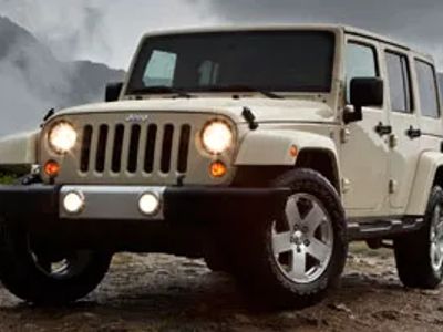 2011 Jeep Wrangler Unlimited — front three-quarter view