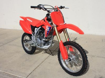 2026 Honda CRF150RT in RED — front three-quarter view