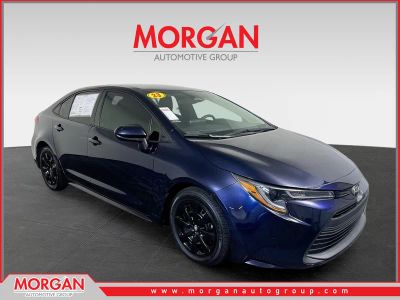 2023 Toyota Corolla LE in Blueprint — front three-quarter view