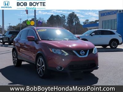 2017 Nissan Rogue Sport SL in Palatial Ruby — front three-quarter view