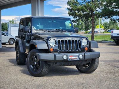 2012 Jeep Wrangler Sport in Black Clearcoat — front three-quarter view