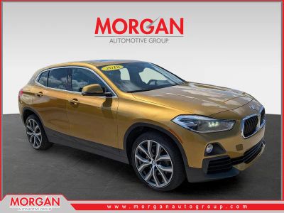 2018 BMW X2 sDrive28i in Gold Metallic — front three-quarter view