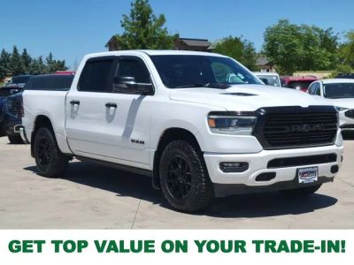 2023 RAM 1500 Laramie in Bright White Clearcoat — front three-quarter view