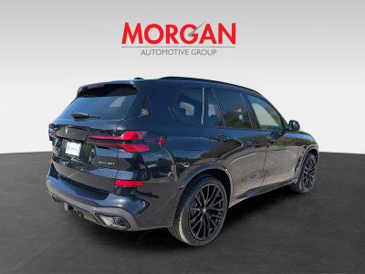 2026 BMW X5 — rear three-quarter view