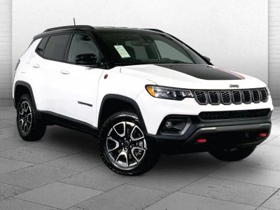 2025 Jeep Compass Trailhawk in Bright White Clea — front three-quarter view