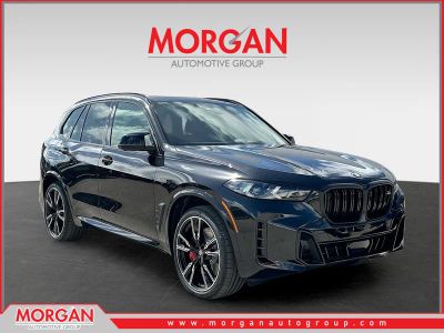 2026 BMW X5 M60i in Black Sapphire Metallic — front three-quarter view
