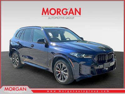 2024 BMW X5 M60i in Blue — front three-quarter view