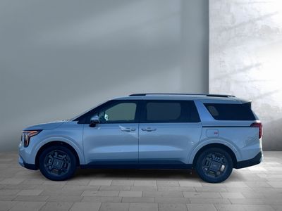 2026 Kia Carnival Hybrid — rear three-quarter view