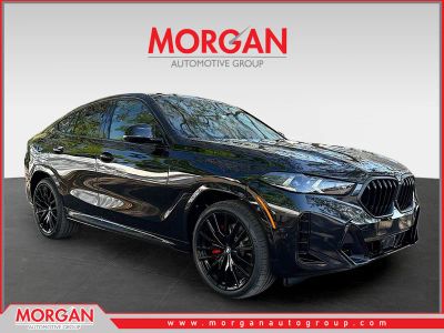 2026 BMW X6 xDrive40i in Black Sapphire Metallic — front three-quarter view