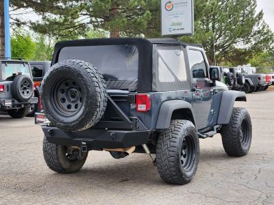 2016 Jeep Wrangler — rear three-quarter view
