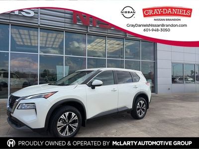 2023 Nissan Rogue SV in Pearl White Tricoat — front three-quarter view