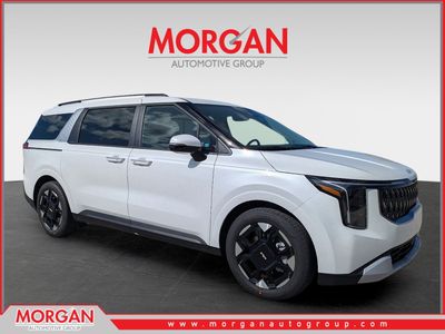 2026 Kia Carnival EX in Snow White Pearl — front three-quarter view
