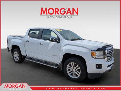 2016 GMC Canyon 4WD SLT in Summit White — front three-quarter view