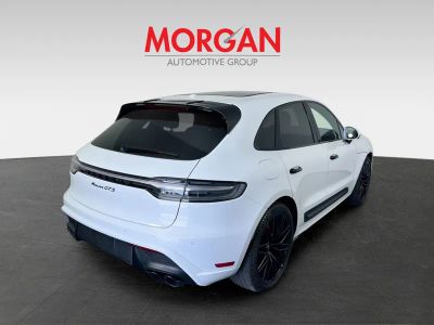 2024 Porsche Macan — rear three-quarter view
