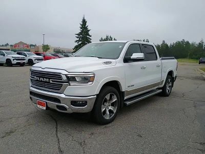 2021 RAM 1500 Laramie in White — front three-quarter view