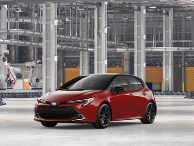 2026 Toyota Corolla Hatchback XSE in Finish Line Red with Midnight Black Metallic roof — front three-quarter view