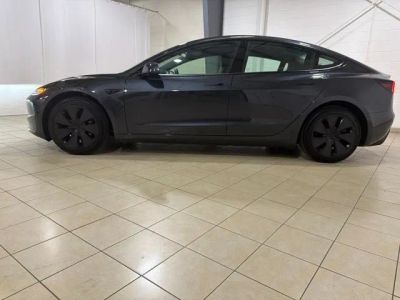 2026 Tesla Model 3 — rear three-quarter view