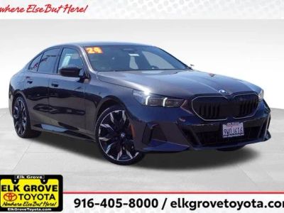 2024 BMW 5 Series 530i in Gray — front three-quarter view