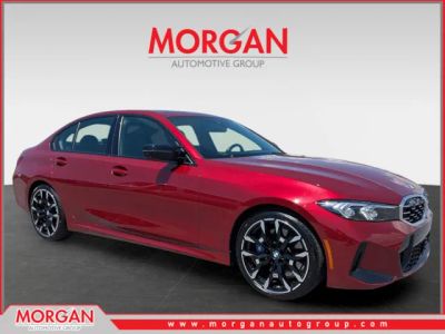 2025 BMW 3 Series M340i in Red — front three-quarter view