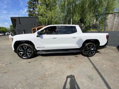 2025 GMC Sierra EV — rear three-quarter view