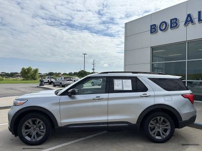 2023 Ford Explorer XLT in Iconic Silver — front three-quarter view