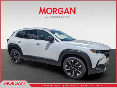 2026 Mazda CX-50 Hybrid Premium Plus in Beige — front three-quarter view