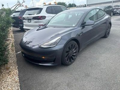 2021 Tesla Model 3 Performance AWD in Solid Black — front three-quarter view