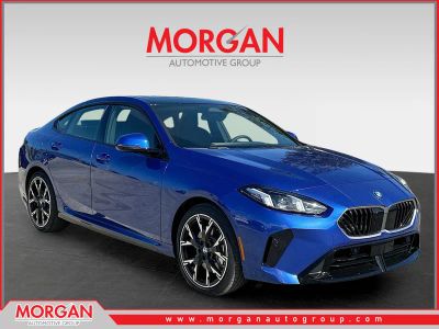 2025 BMW 2 Series 228 xDrive in Portimao Blue Metallic — front three-quarter view
