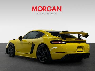 2025 Porsche 718 Cayman — rear three-quarter view