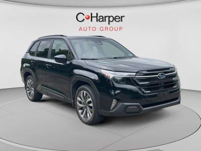 2025 Subaru Forester Touring in Black — front three-quarter view