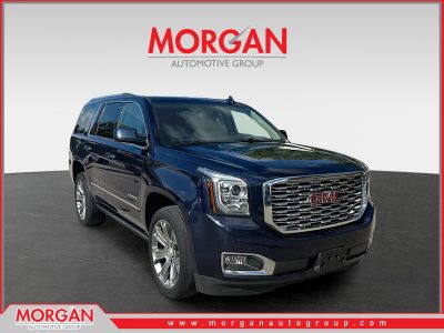 2020 GMC Yukon Denali in Dark Sapphire Blue Metallic — front three-quarter view