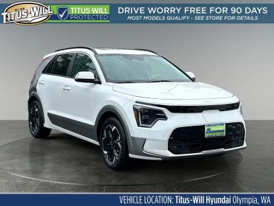 2023 Kia Niro EV Wave in Snow White Pearl — front three-quarter view