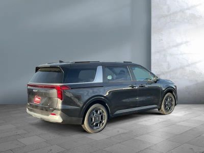 2026 Kia Carnival Hybrid — rear three-quarter view