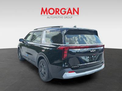 2026 Kia Carnival Hybrid — rear three-quarter view