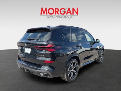 2026 BMW X5 — rear three-quarter view