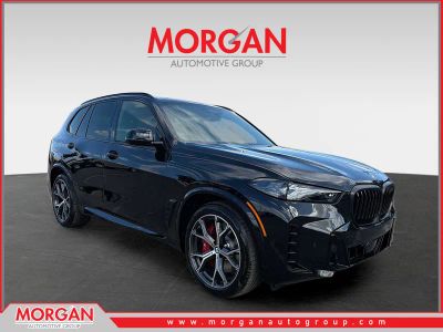 2026 BMW X5 xDrive50e in Black Sapphire Metallic — front three-quarter view